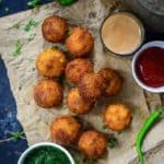 Make these super addictive Corn Cheese Balls for your next house party and see them disappear in seconds. These are easy to make, cheesy, crispy, freeze well and taste amazing. Here is how to make Corn Cheese Balls Recipe.