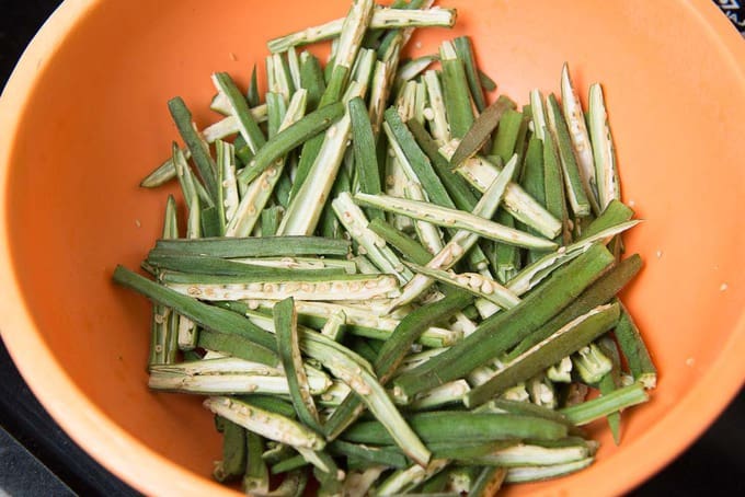 Bhindi cut into thin slices in a bowl