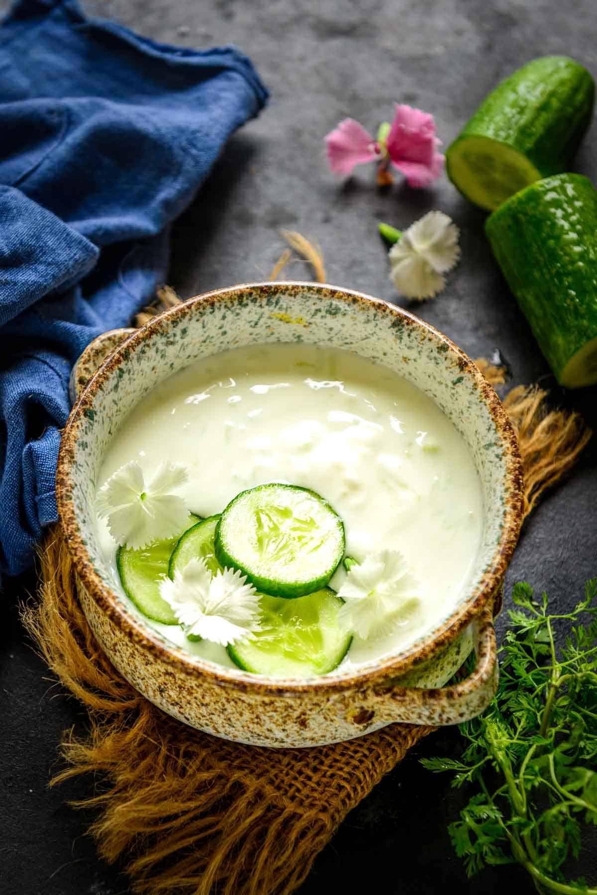 Cucumber raita served in a bowl.