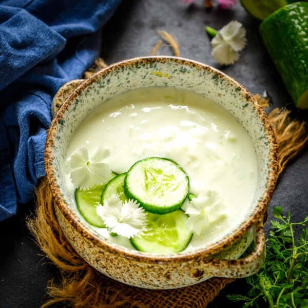 Cucumber Raita (Kheere Ka Raita) is a creamy Indian side dish made with grated cucumbers, yogurt, and spices. Follow my easy recipe to make it.