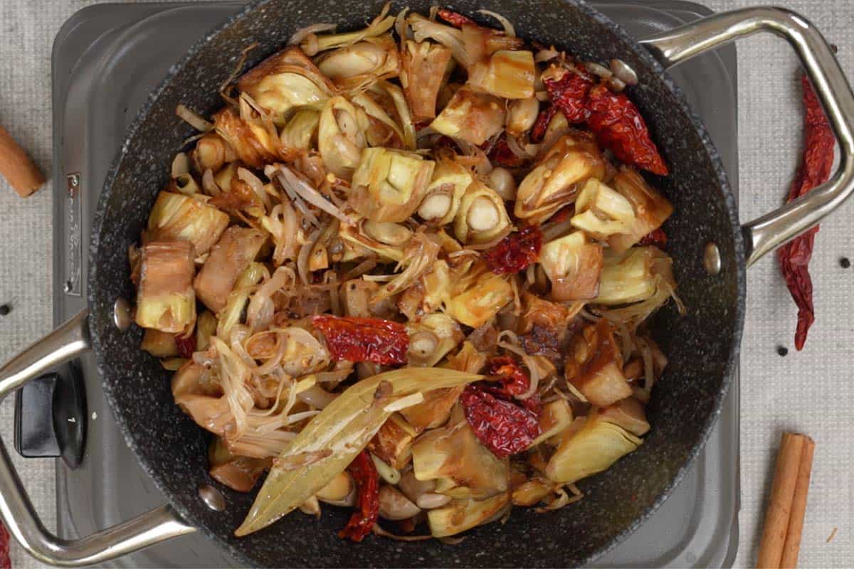 Fried kathal, salt and water added to the pan.