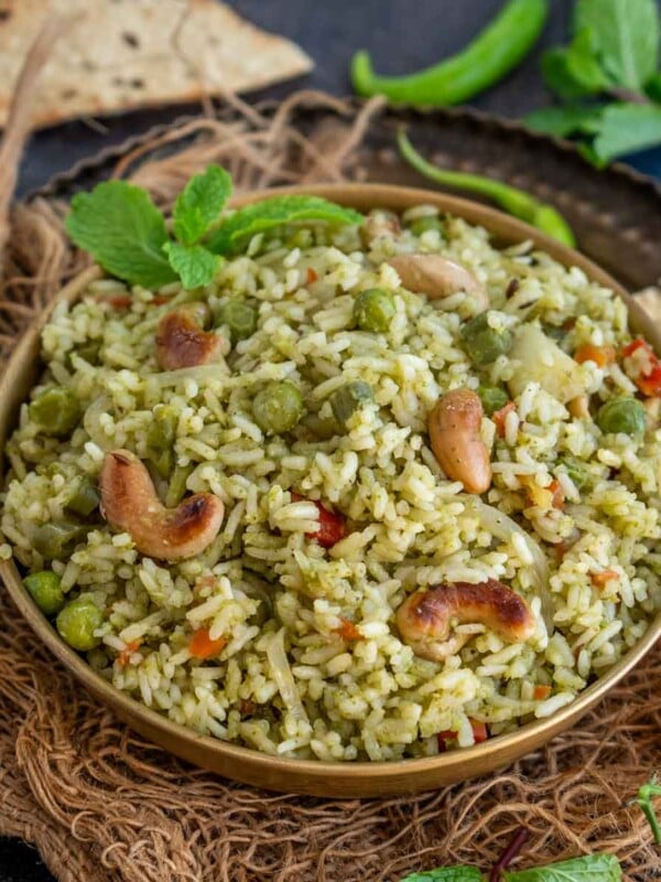 Pudina Rice (Mint Rice, Pudina Pulao) is a delicious one-pot South Indian dish made using rice, fresh mint leaves, veggies, and a few spices. Serve it with raita for a comforting meal (vegan, gluten-free).