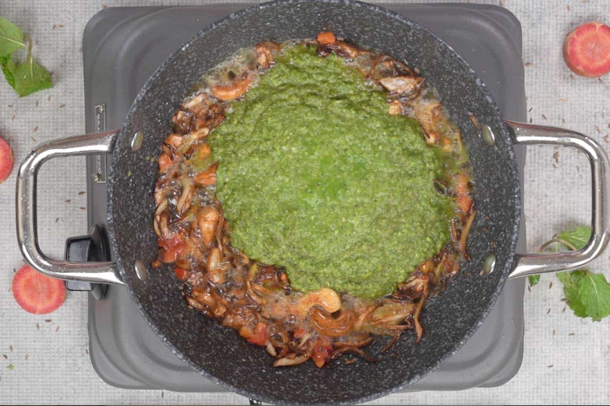 Mint coconut paste added to the pan.