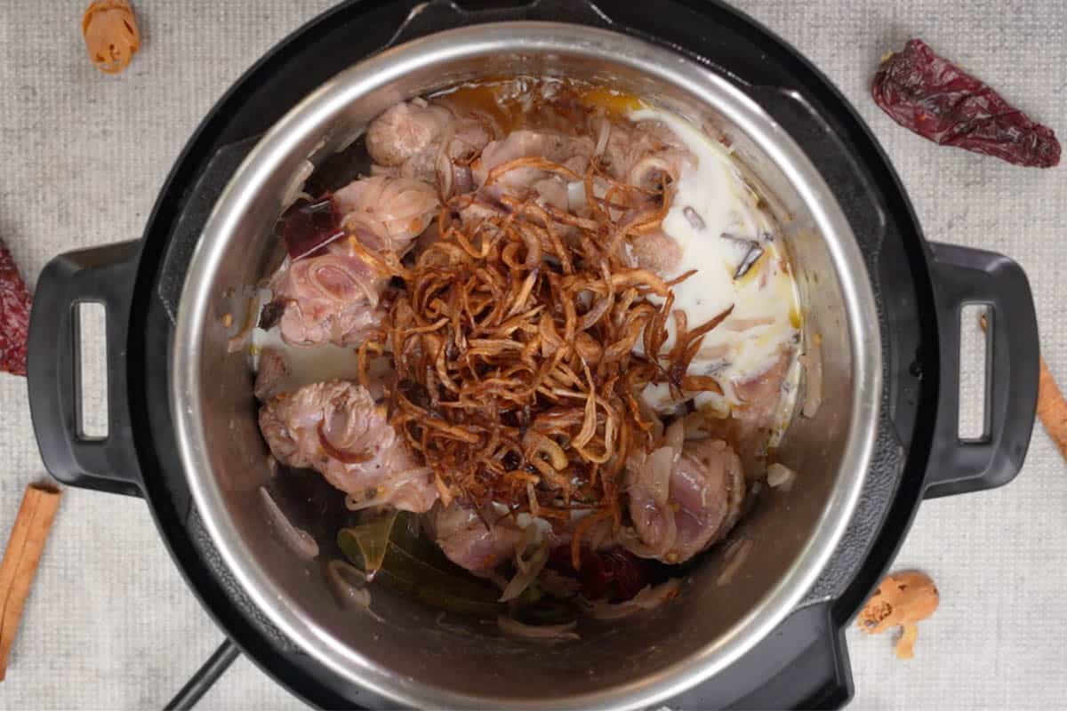 Yogurt, salt and fried onions added to the pot.