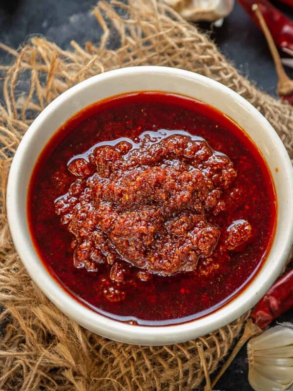 Rajasthani Garlic Chutney is a spicy chutney made using red chilies and lots of garlic. Each home has a different way of making it and each version is delicious on its own. I am sharing 4 ways to make this fiery spicy chutney in this post (vegan, gluten-free).