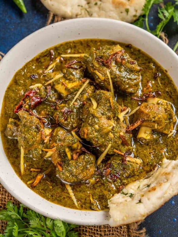 Saag Gosht is a North Indian winter delicacy where goat mutton (or lamb) is cooked in a gravy made using various winter greens. Serve it with makki ki roti or any other Indian bread for a hearty meal (gluten-free).