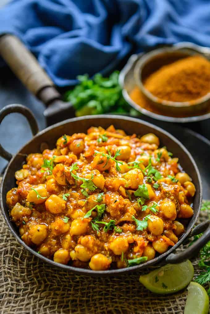 Achari chole served in a bowl.