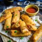 Spring rolls is a classic Indo Chinese dish perfect for evening snacks or entertaining guests. Use this simple Spring Roll Recipe and make these at home.