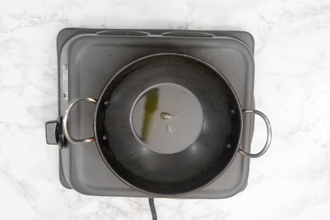 Ghee heating in a pan.