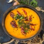 Kerala Sambar is a curry made using lentils, vegetables, tamarind, and freshly ground coconut masala. Try this traditional recipe at home.