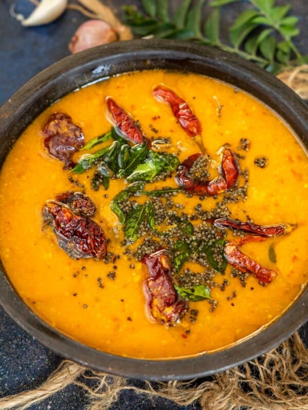 Kerala Sambar is a curry made using lentils, vegetables, tamarind, and freshly ground coconut masala. Try this traditional recipe at home.