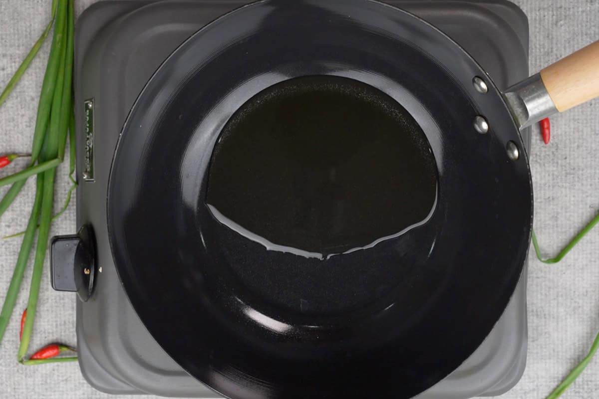 Oil heating in a wok.