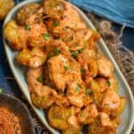 Cajun Potatoes are crispy fried baby potatoes topped with a creamy and spicy mayonnaise dressing. Try this BBQ nation-style dish at home using my easy recipe.