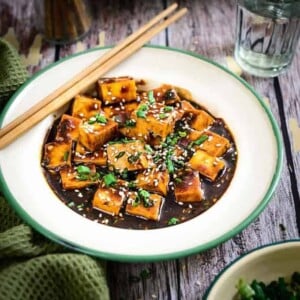 Asian Style Garlic Tofu is a simple healthy dish where tofu coated with Oriental sauces and spices is pan fried & cooked. Pair it with rice for a full meal.