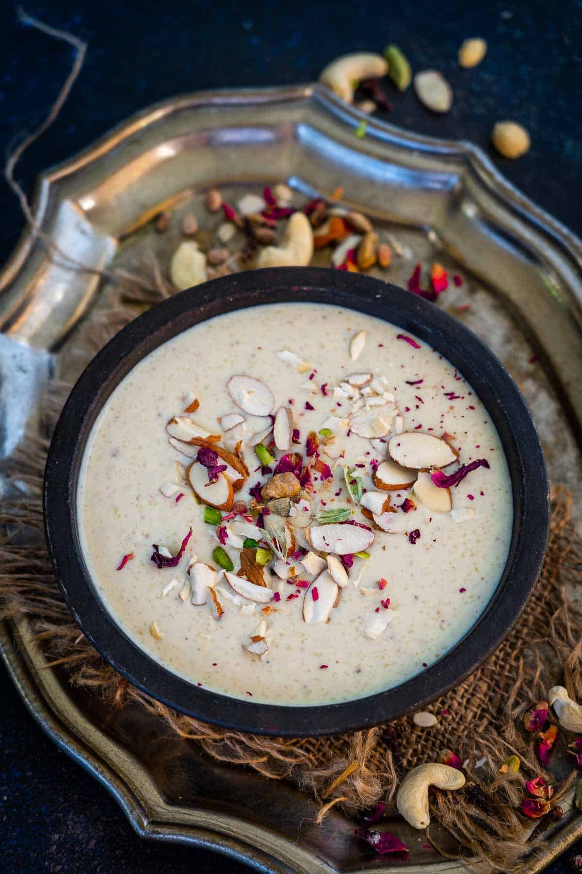 Thandai phirni served in a bowl.