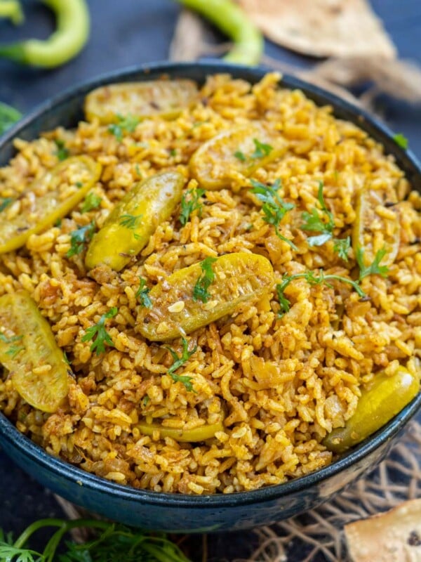 Maharashtrian Tendli Bhaat (Tondli Bhat) is a spicy rice preparation with ivy gourds added to it. It comes together in under 30 minutes and makes for a quick meal or lunch box option.