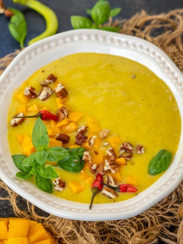 Mango Gazpacho is a chilled Spanish soup made using mangoes, oranges, cucumber, and a few other simple ingredients. It is a perfect soup to sip on hot summer days (vegan, gluten-free).