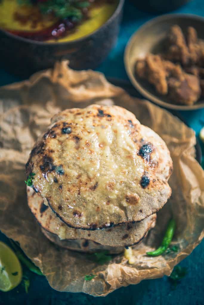 Bajre Ki Roti is a millet-based flatbread which can be served with both, vegetarian as well as non-vegetarian curries. Serve it piping hot with ghee.