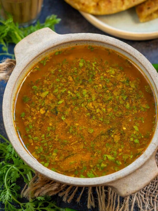 Katachi Amti is tangy and spicy Maharashtrian dal prepared with chana dal (Bengal gram), dry coconut, tamarind pulp, jaggery, and a few spices. This thin tempered dal is popularly served with puran poli (vegan).