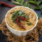 Peanut Coriander Chutney is a delicious South Indian style chutney made using roasted peanuts, fresh coriander leaves (cilantro), and yogurt. This delicious chutney is great to serve with idli, dosa, uttapam, paniyaram, etc (vegan, gluten-free).