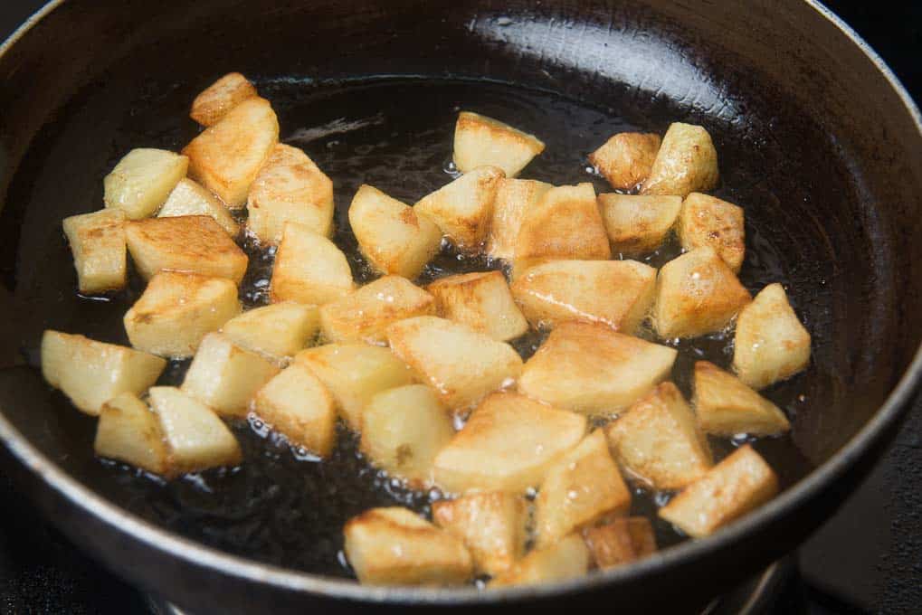 Potato cubes fried until browned