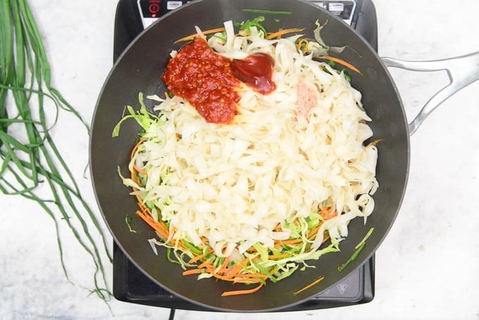Noodles and sauces added in the pan.