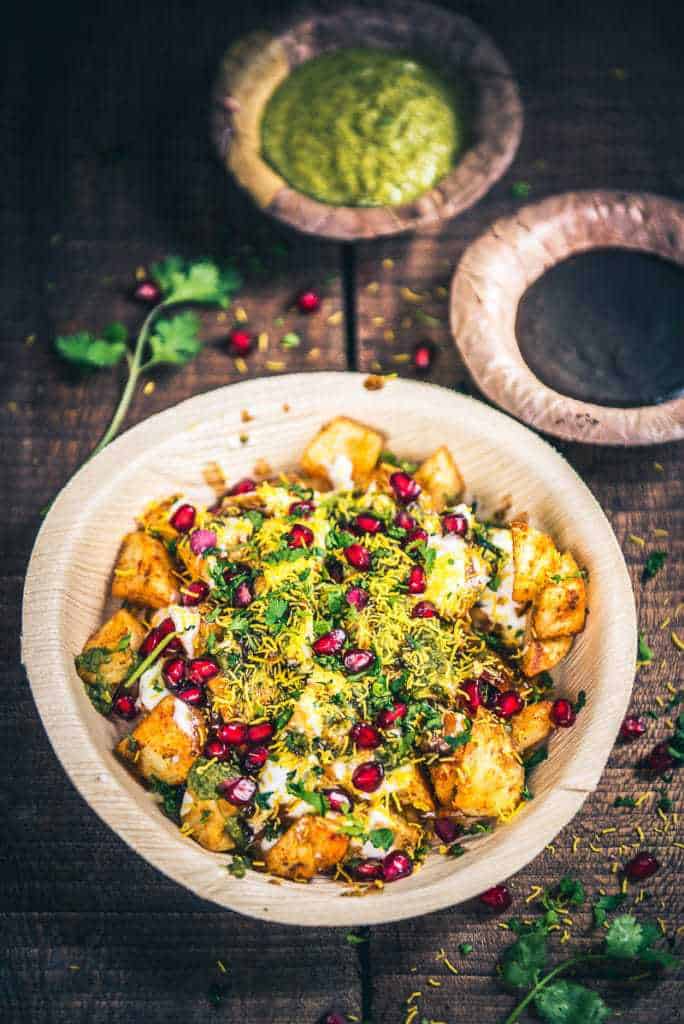 Aloo chaat served in a bamboo bowl.