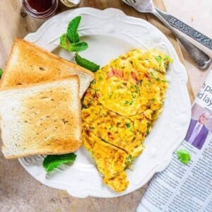 Masala Omelette is a super quick egg recipe which can be whipped in no time and makes for a lovely breakfast.