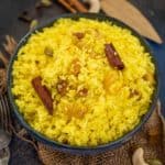 Basanti Holud Mishti Pulao (Sweet Bengali Polao, Basanti Pulao) is a mildly sweet rice preparation very popular in Bengal. It is served with Kosha Mangsho (Bengali Mutton Curry) for all the festivals and special occasions. Learn to make it in a traditional way (gluten-free).