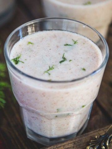 Ragi Ambli is a traditional South Indian beverage made from finger millet (ragi) flour and buttermilk. Make it using my easy recipe (vegetarian).