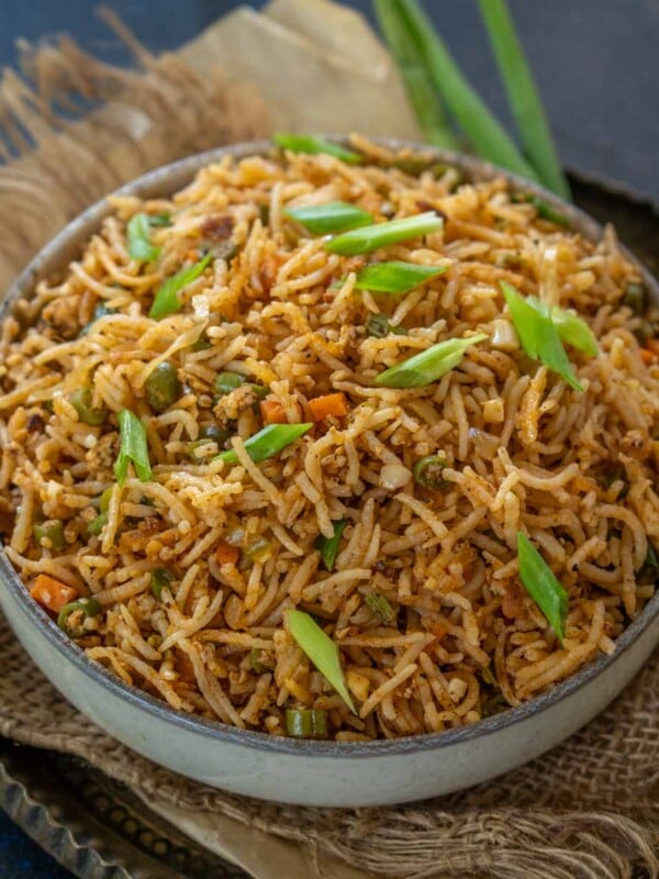 Schezwan egg fried rice served in a bowl.