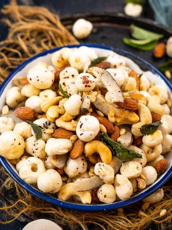 Roasted Makhana Chivda (Makhana Namkeen) is a healthy and delicious snack that can be served at tea time or can be munched throughout the day. It is low-fat, healthy, and gluten-free and can be served for vrat (Hindu fasting days) as well. Sharing the recipe to make it in a pan over the stovetop and also in an air fryer.