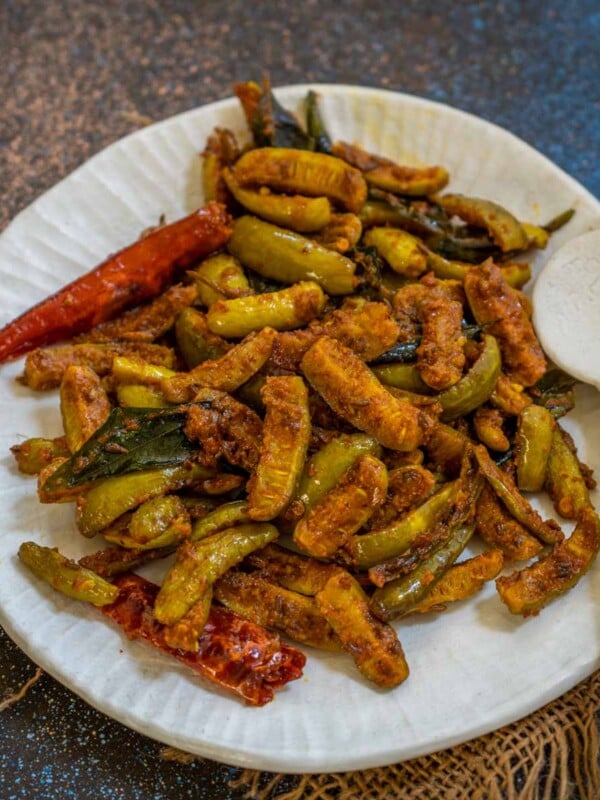 Tindora Fry is a North Indian-style spicy stir-fried Ivy gourd sabji. Serve it for your everyday meals with rice or roti (vegan, can be easily made gluten-free).