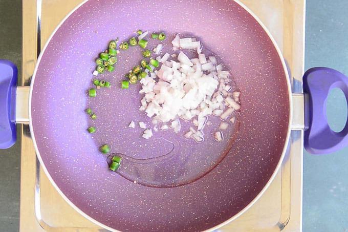 Onion and green chilli added in the pan