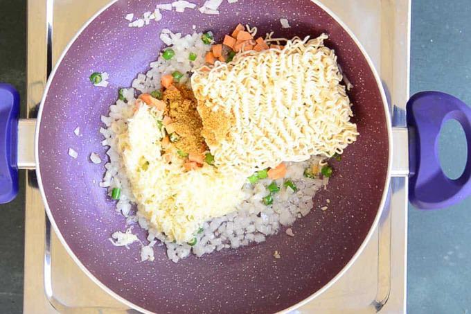 maggi along with taste maker added in the pan