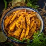 Achari Aloo Masala (Aloo Achari) is a North Indian style potato dish made using Indian pickling spices. It is spicy, and tangy, and can be served with parathas for breakfast or as a side dish with your everyday meals. Here is how to make it (vegan).