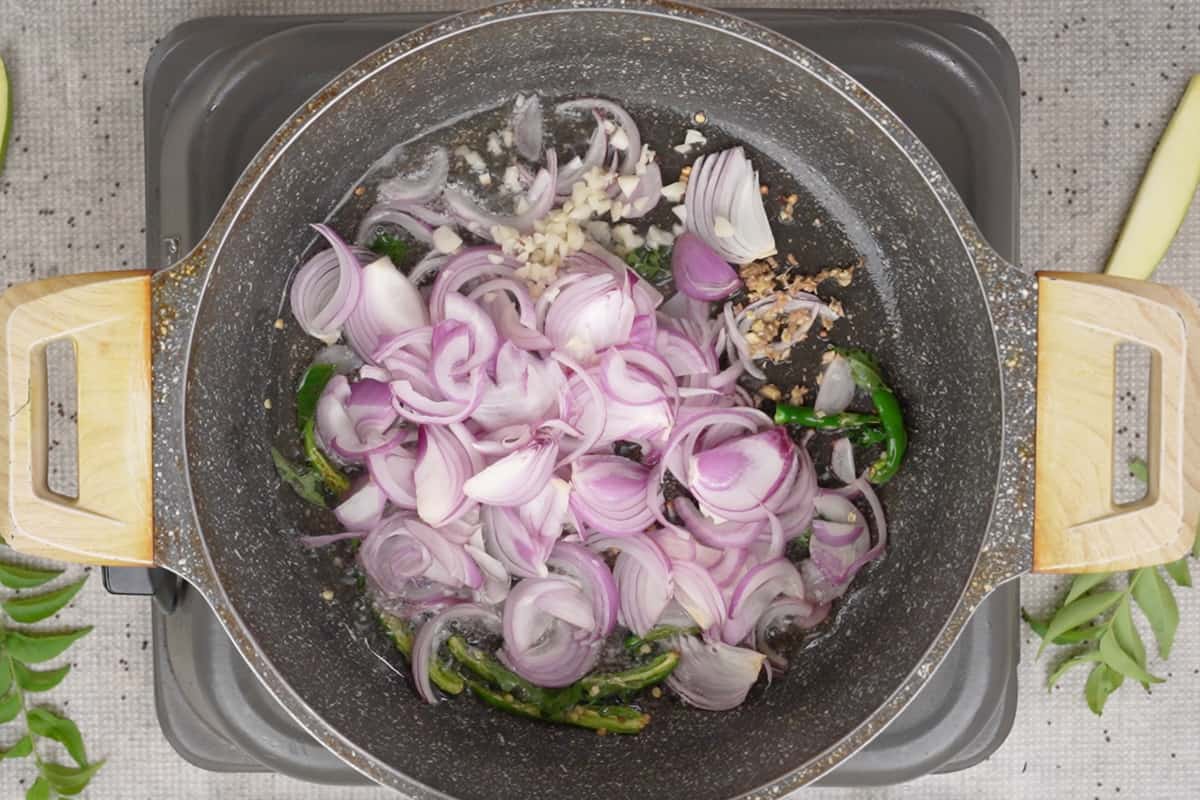 Onions, ginger and garlic added to the pan.