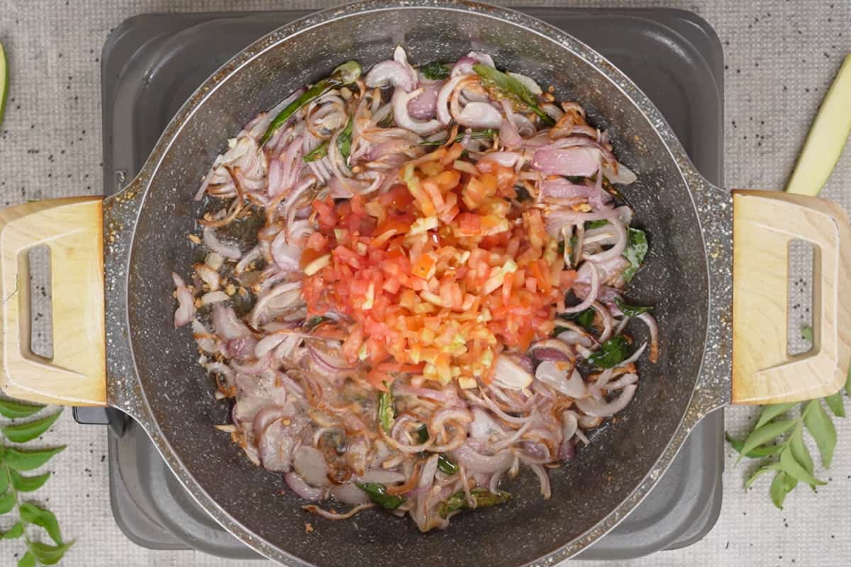 Tomatoes added to the pan.