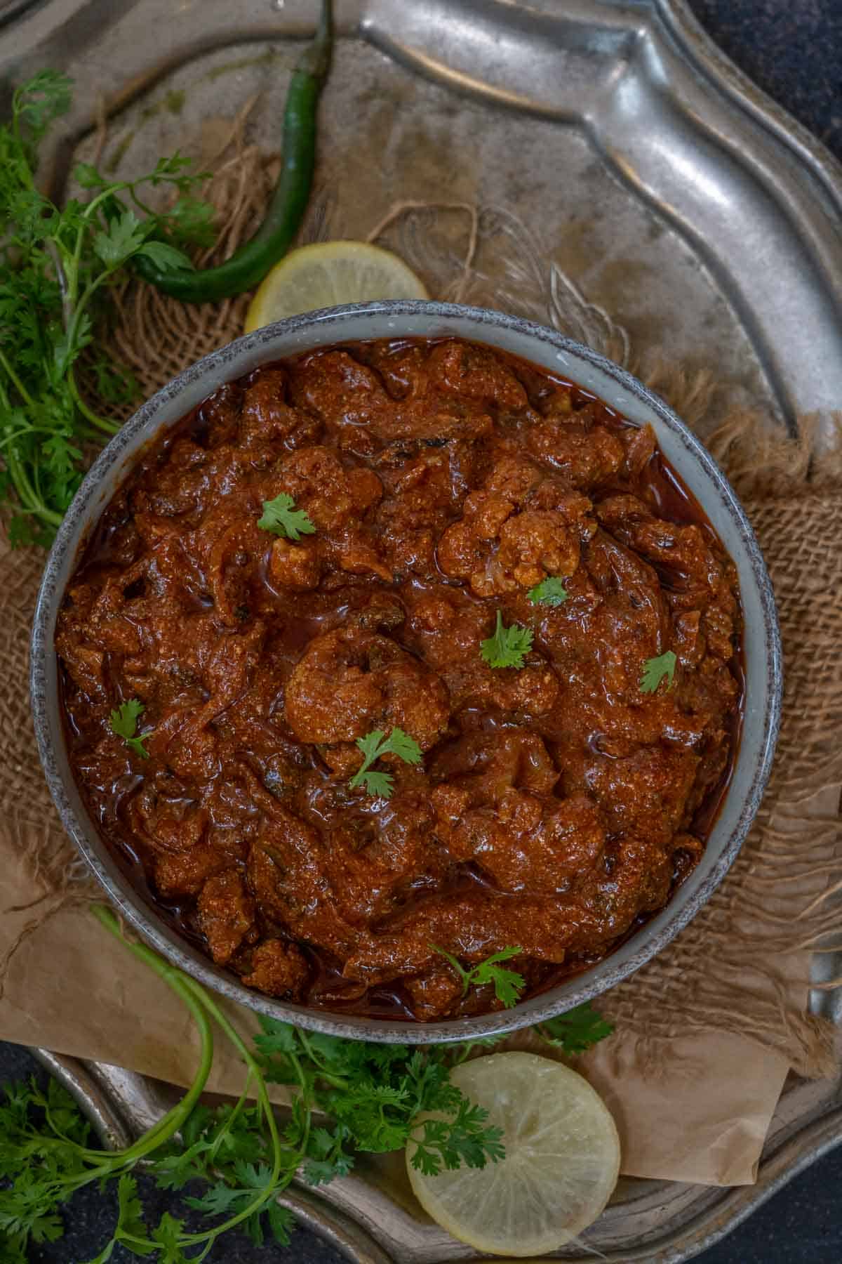 Achari gobhi curry served in a bowl.