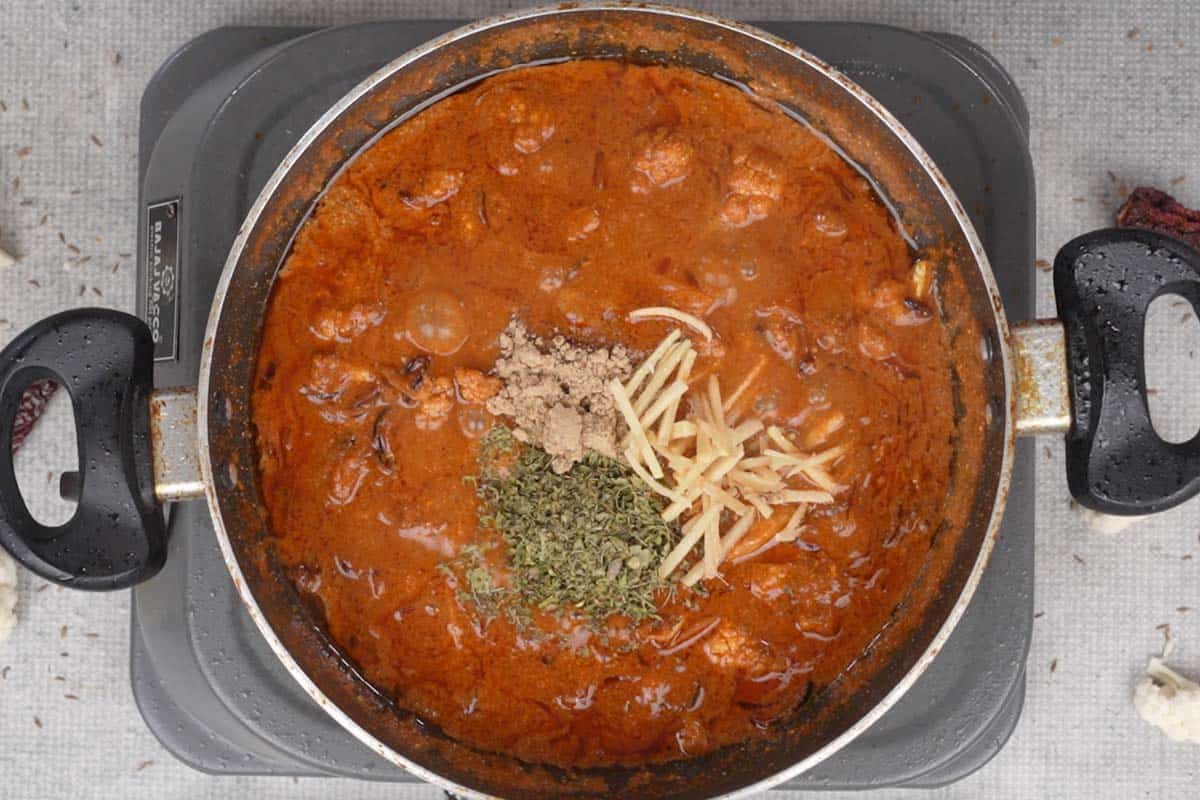 Lime juice, Kasuri methi, ginger and dry mango powder added to the pan.