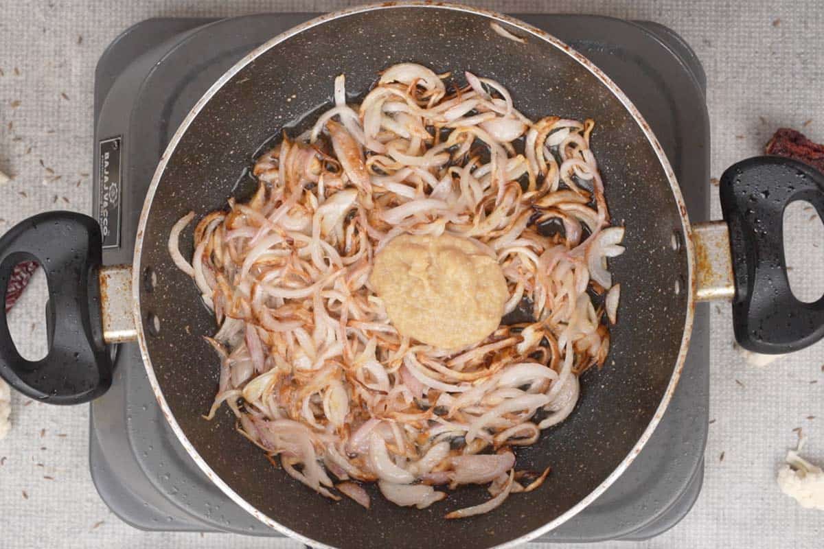 Ginger garlic paste added to the pan.