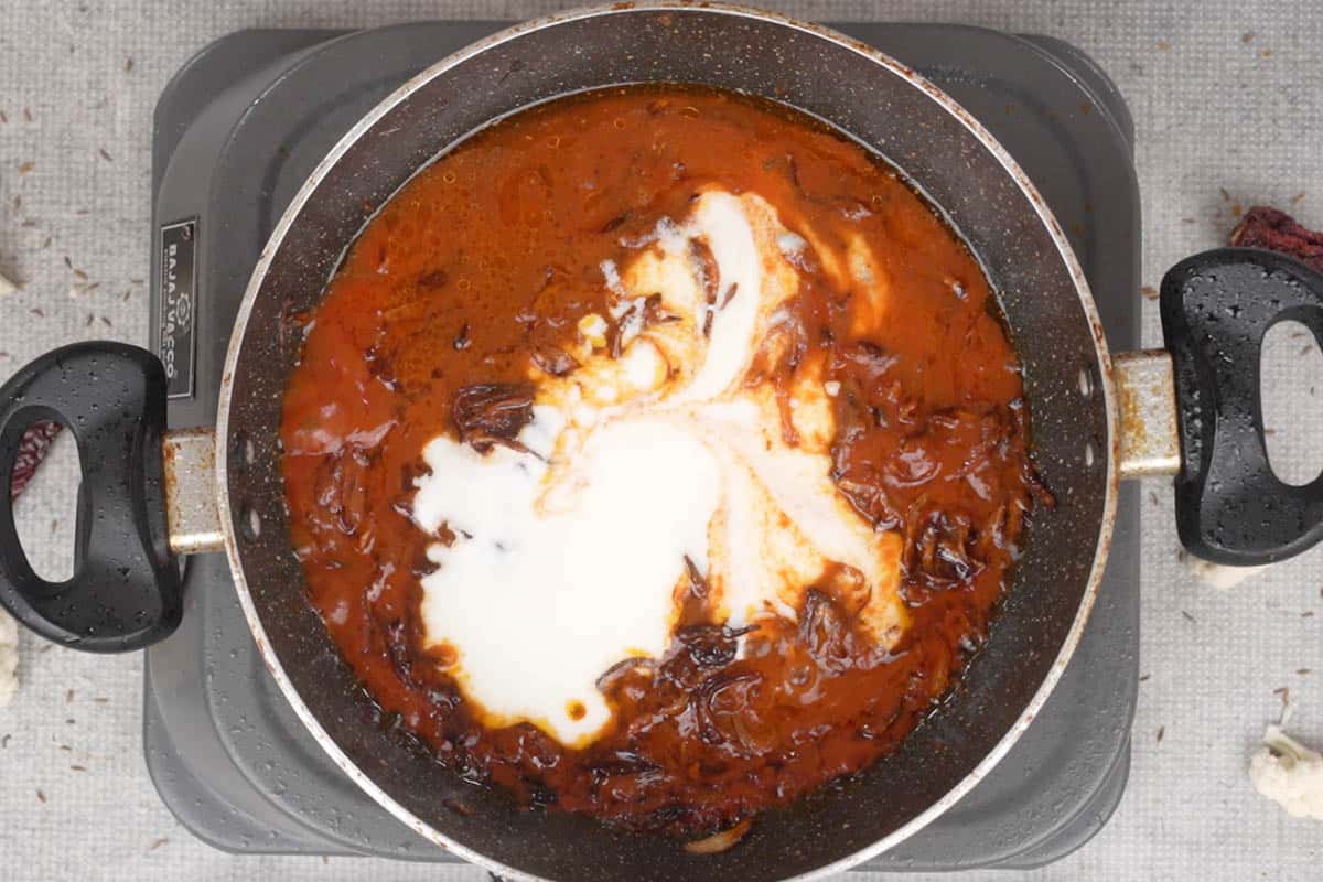 Yogurt added to the pan.