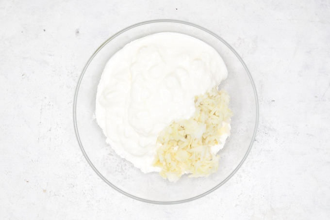 Sama flour, potato and curd added in a bowl.