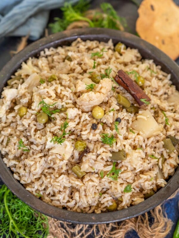 Brown Rice Pulao is a delicious version of the classic pulao recipe, where white rice is replaced with brown rice. You can make this one-pot meal in an instant pot or a traditional pressure cooker.