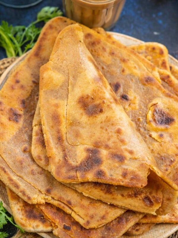 Masala Paratha is a spicy variation of the plain paratha where a spice mix is added to the recipe. Serve it with a cup of masala chai for a hearty breakfast or evening snack.