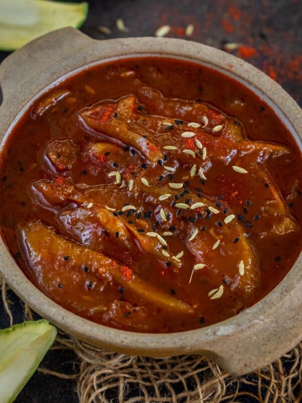 Kacche Aam Ki Launji is a sweet and spicy chutney made using tangy green mangoes, jaggery, and a few simple spices. This chutney keeps good in the refrigerator for upto 3 months. So make a big batch and enjoy!