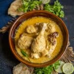 Bengali chicken rezala served in a bowl.