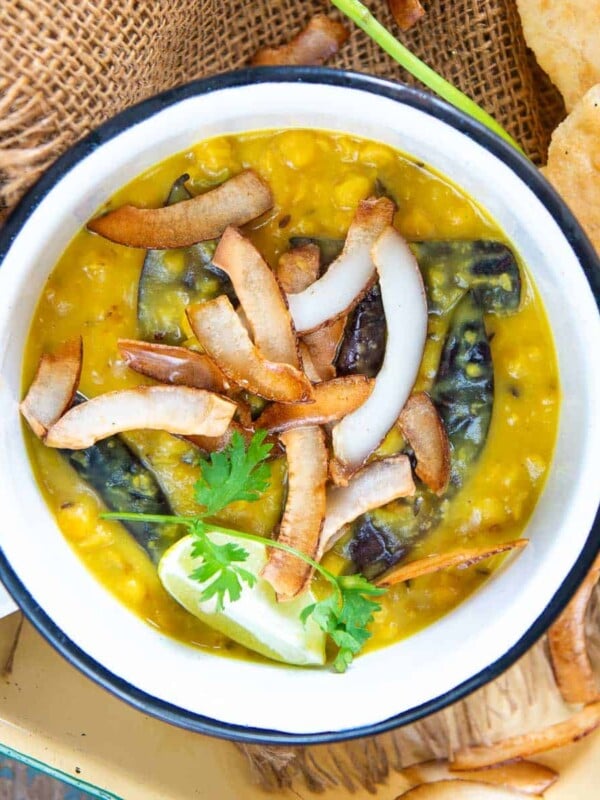 Cholar Dal (Bengali Style Chana Dal) is a traditional Bengali lentil dish prepared from chana dal (Bengal gram lentil), ghee, coconut, and a few spices. It is sweet and savory and is best paired with luchi or steamed rice.