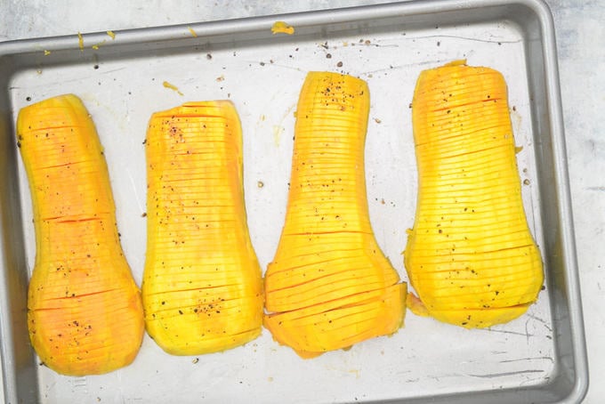 Cut squash placed on the baking tray.