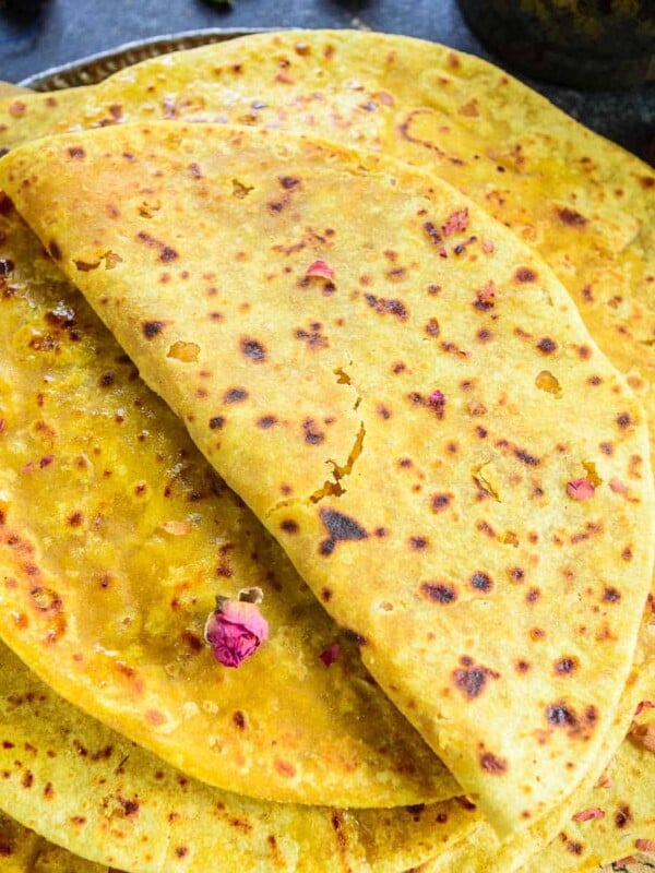 Puran Poli Sweet (Pooran Poli) is a traditional Indian sweet dish (Maharashtrian) made using whole wheat flour dough stuffed with a sweet lentil filling. Serve it with a dollop of ghee and milk on the side for a delicious breakfast, snack, or dessert (vegetarian).
